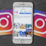Smartphone displaying Instagram feed amid logo cards